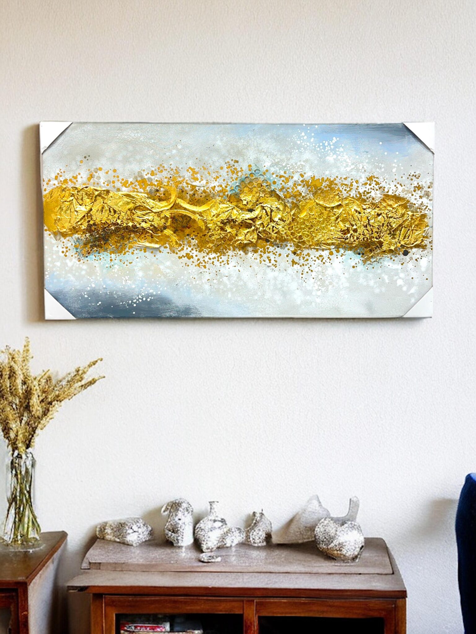 Gold embossed canvas wall art styled in a living room